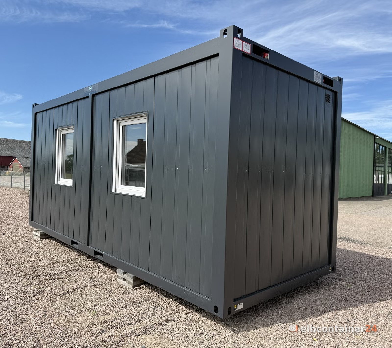 Dunkelgrauer Bürocontainer mit Fenstern